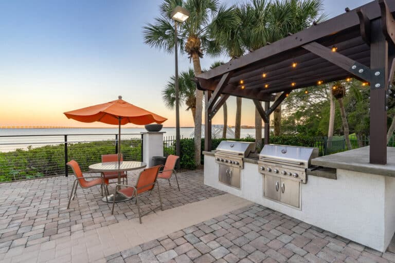 Outdoor grilling station at Bayside Arbors of Clearwater apartments.
